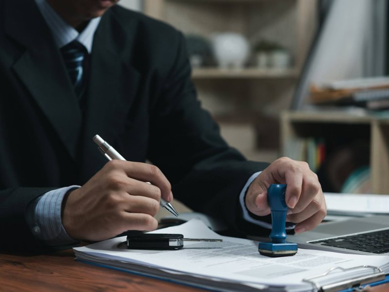 businessman-signing-a-contract-for-buying-of-selling-a-car-car-rental-service-insurance-and-contra-ql6gxloq1eqrd8hcvoxrv9dqvrgyo6lg42d0qxoj1s (1)